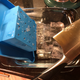 I chipped off the ice detritus with a cleaver, but a butter knife and a little bit of elbow grease probably could have done the job, as it wasn’t fully frozen. The clear ice cubes are still inside the blue mold in this photo.